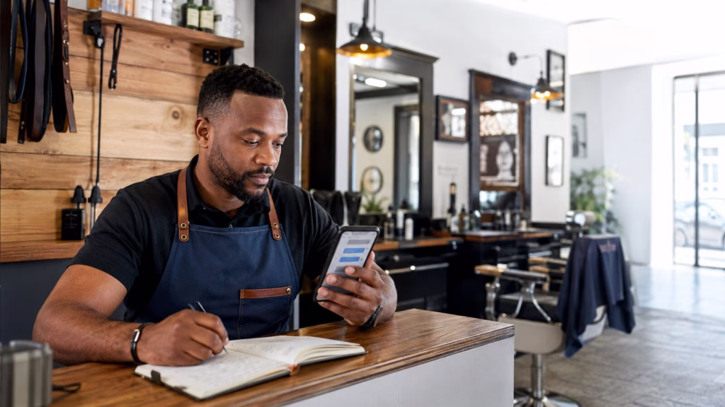 South African small business owner managing customer enquiries in WhatsApp Business
